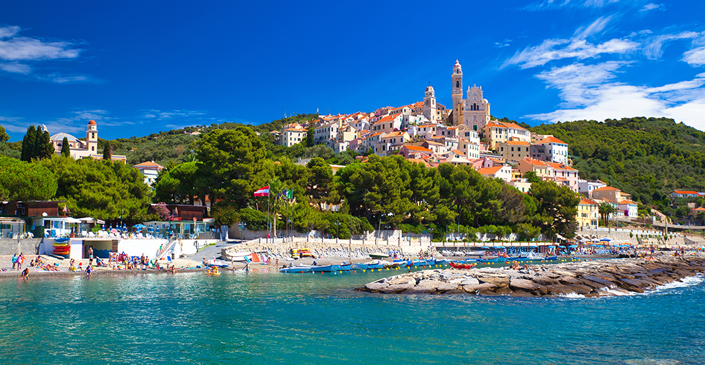 View to the village and harbor of Cervo at sunny blue sky