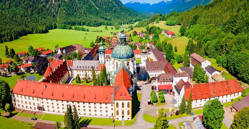 Ettal Abbey aerial panoramic view. Ettal Abbey is a Benedictine monastery in the village of Ettal close to Oberammergau and Garmisch-Partenkirchen in Bavaria, Germany