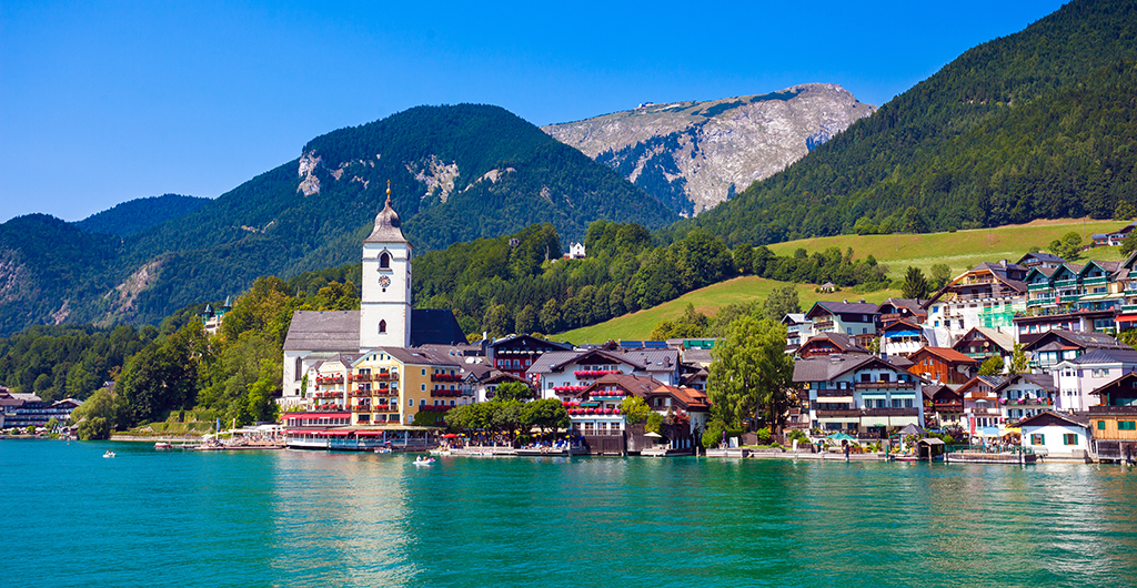 View of View of St. Wolfgang chapel and the village waterfront at Wolfgangsee lake, Austria