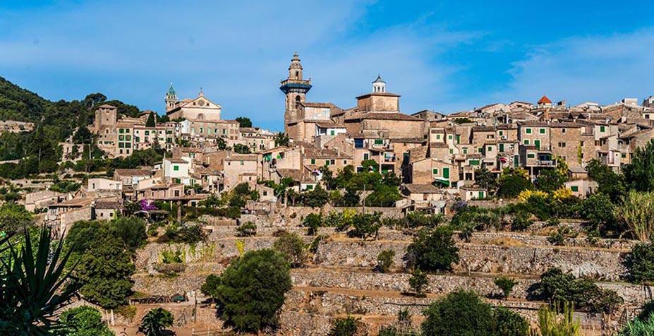 Beautiful view of the small town Valldemossa situated in picturesque mountains on Mallorca island, Spain.