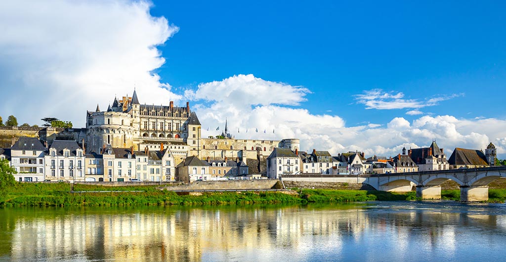 Beautiful view on the skyline of the historic city of Amboise with renaissance chateau across the river Loire. France