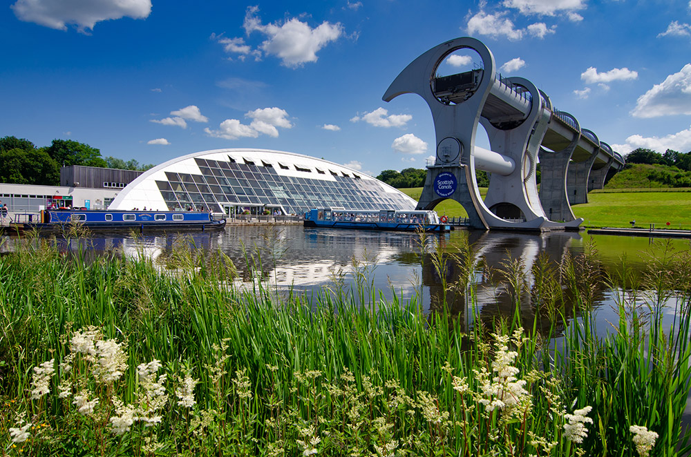 The Falkirk Wheel in Scotland is a rotating boat lift linking the Forth and Clyde Canal with the Union Canal