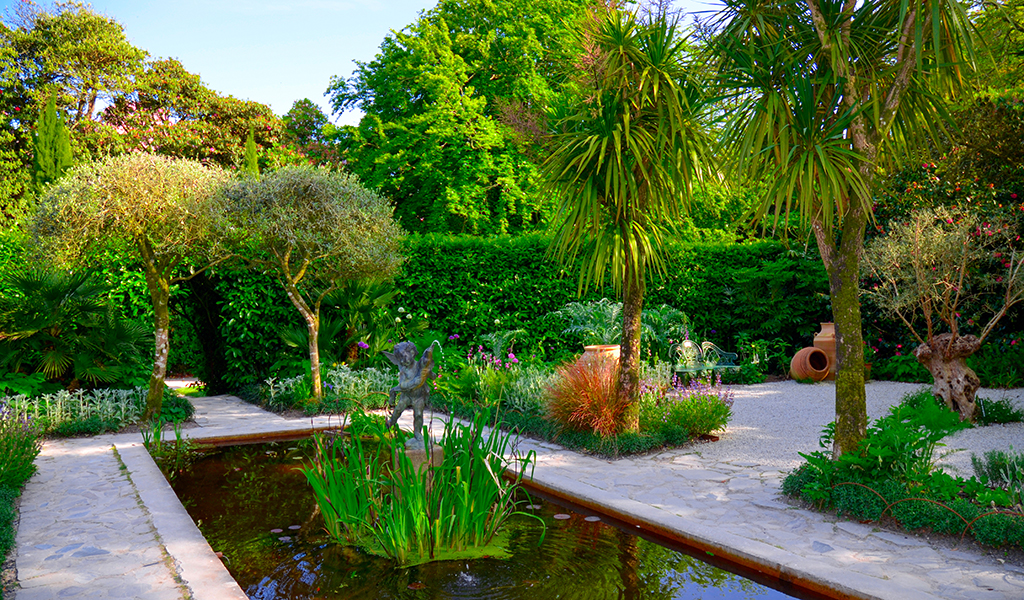 British Gardens with the Pond. Garden The British Lost Gardens of Heligan Pentewan Cornwall. Ornamental garden pond UK