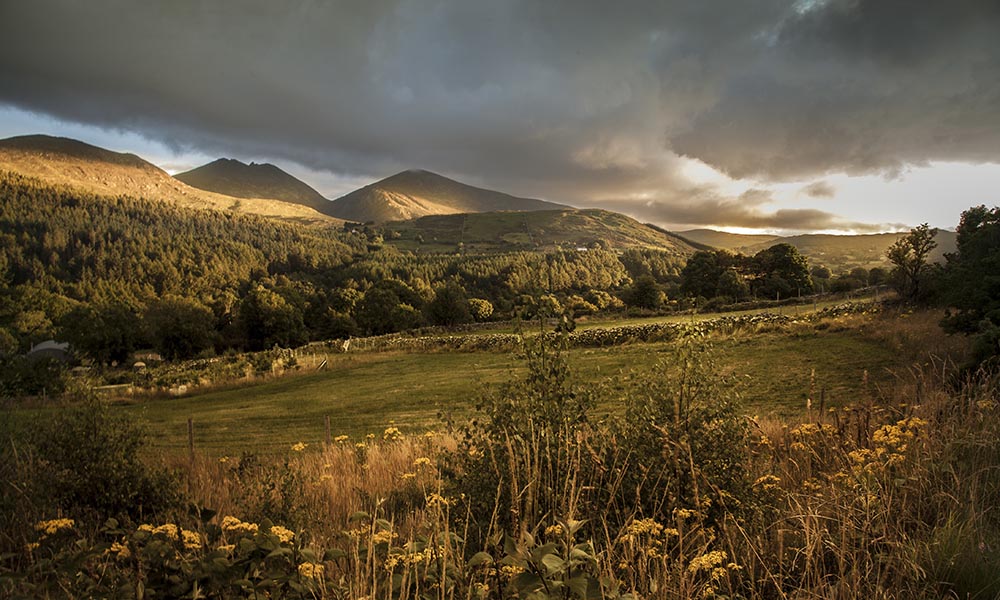 A beautiful shot of the hills during the sunset in the Mountains of Mourne in Northern Ireland